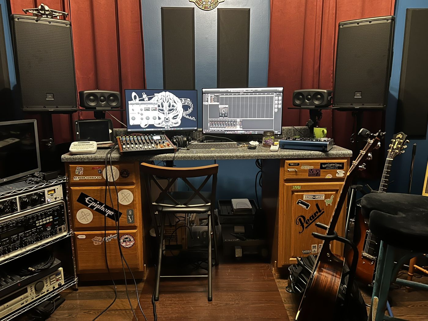 Chris’s recording studio with mixing desk, studio monitors and guitars